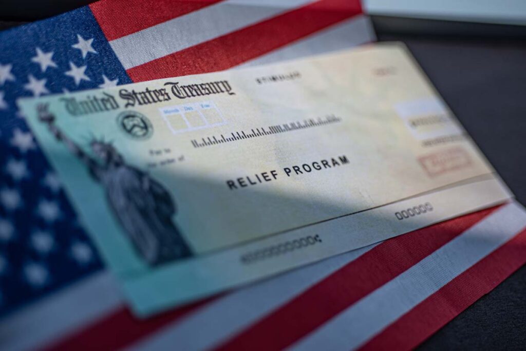 stimulus check in front of an American flag