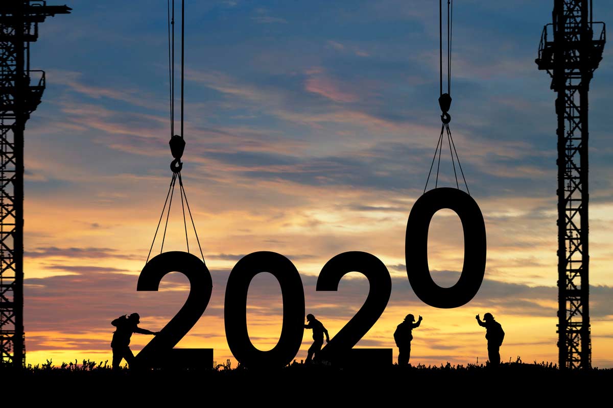 2020 numbers being lifted by a crane and construction workers