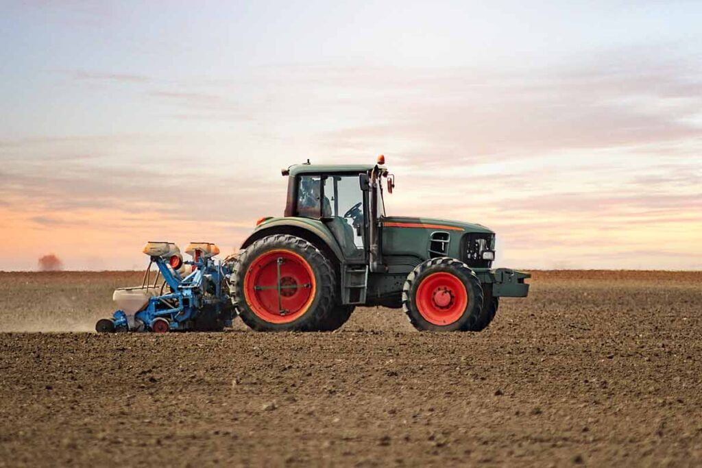 tractor moving through a field