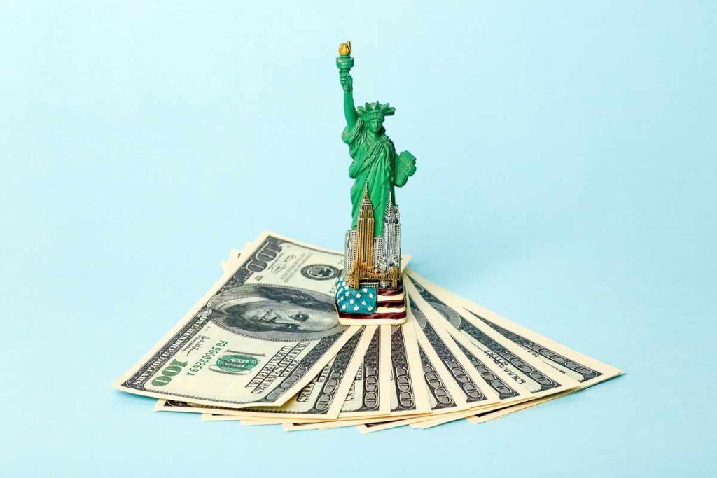 Money and Statue of Liberty