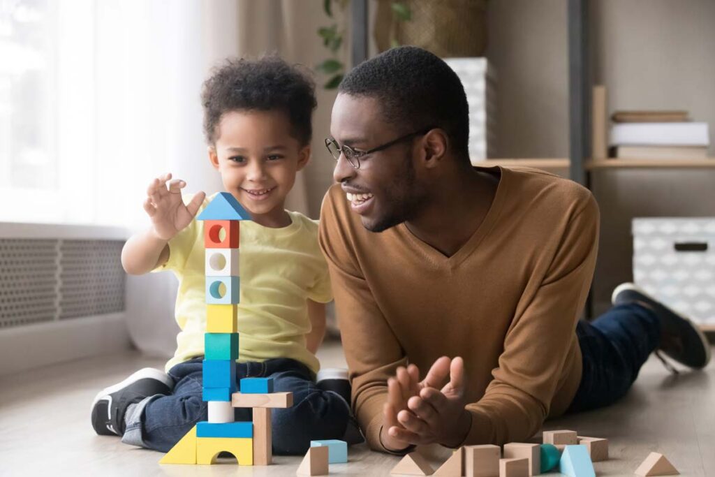 Dad and son playing with blocks