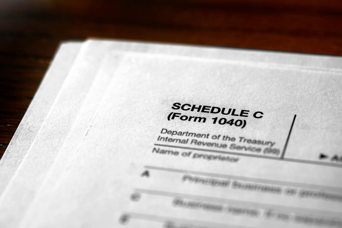 stack of documents with "schedule c" printed on top