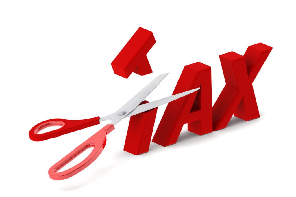 scissors cutting the word "Tax"