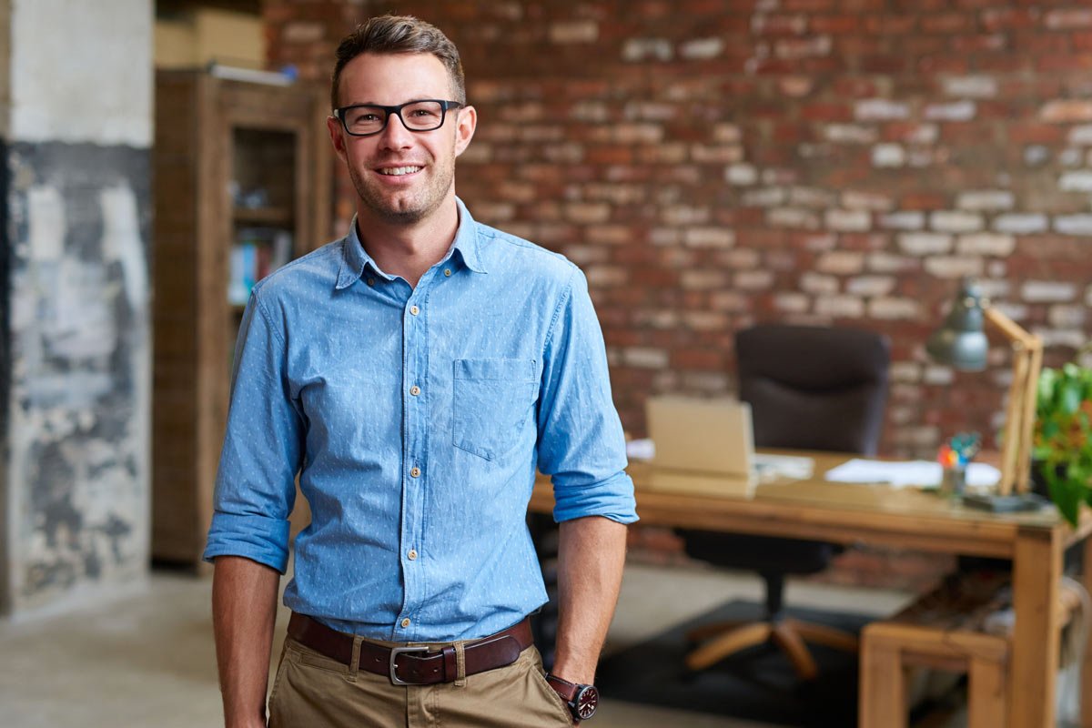 man smiling in an office