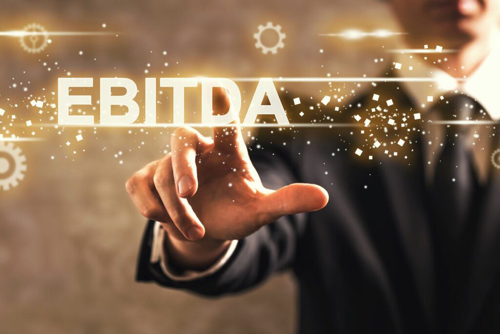 a hand pointing to "EBITDA" that is glowing