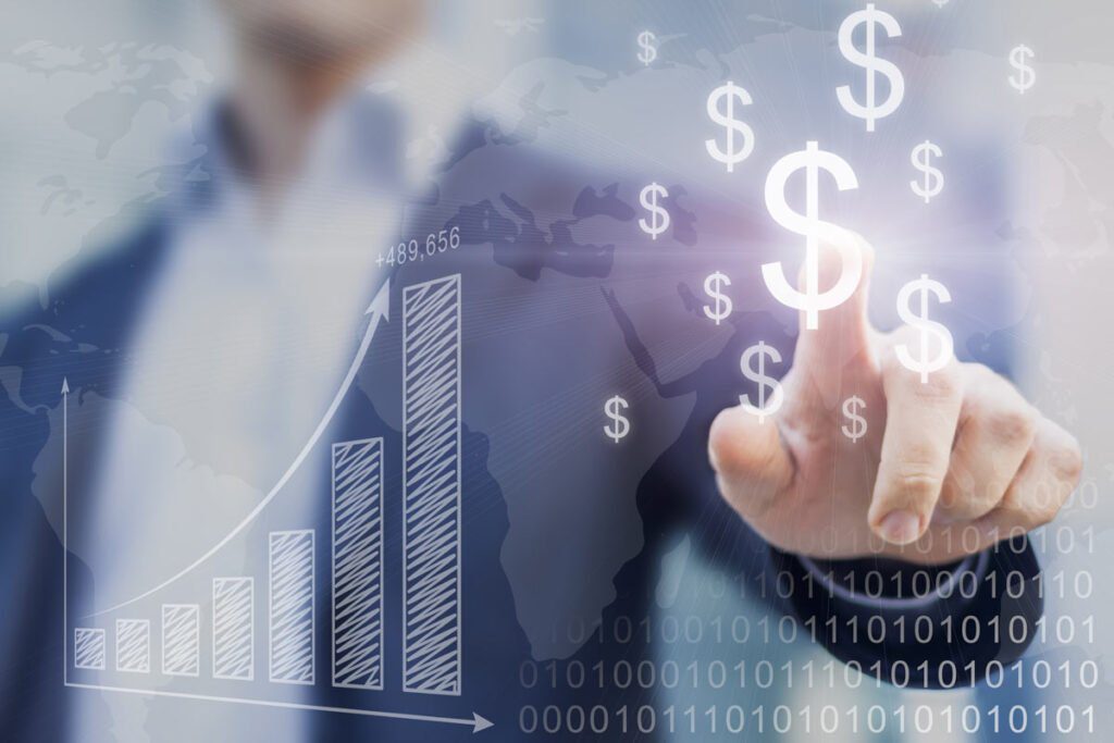 hand pointing to dollar signs next to a graph showing increases