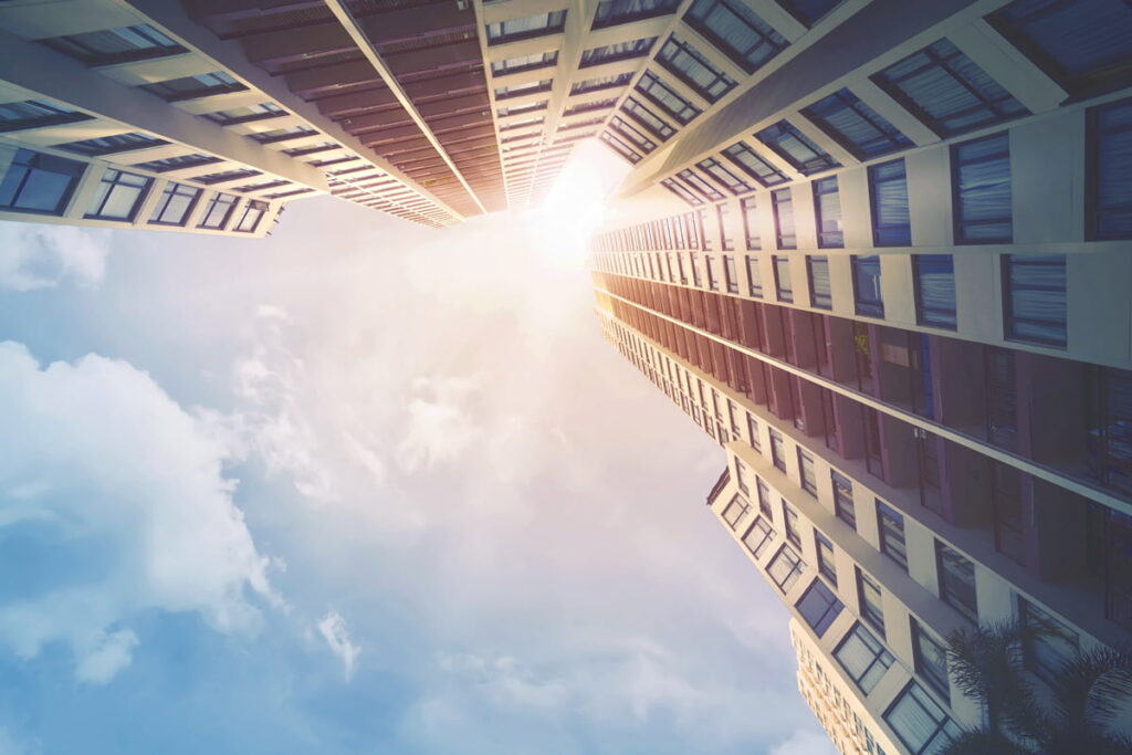 apartment from ground level looking up at sky