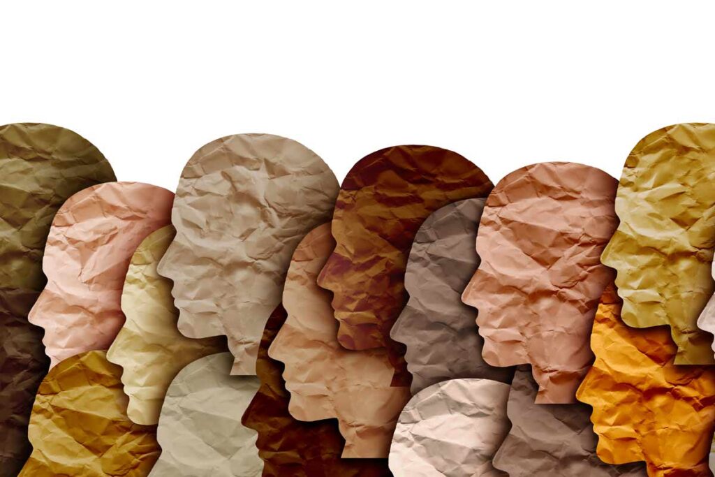 paper cutouts of heads of different skin-toned colors