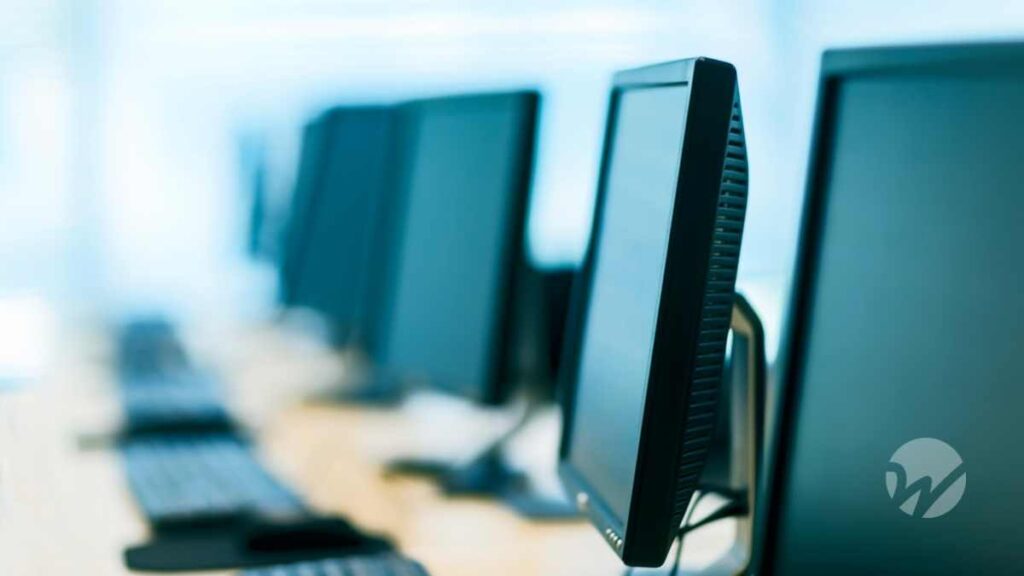 Row of new business computers symbolizing technology investments eligible for Section 179 deductions.