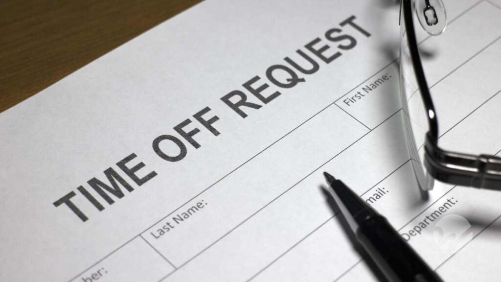 time off request form with pen and glasses laying on top