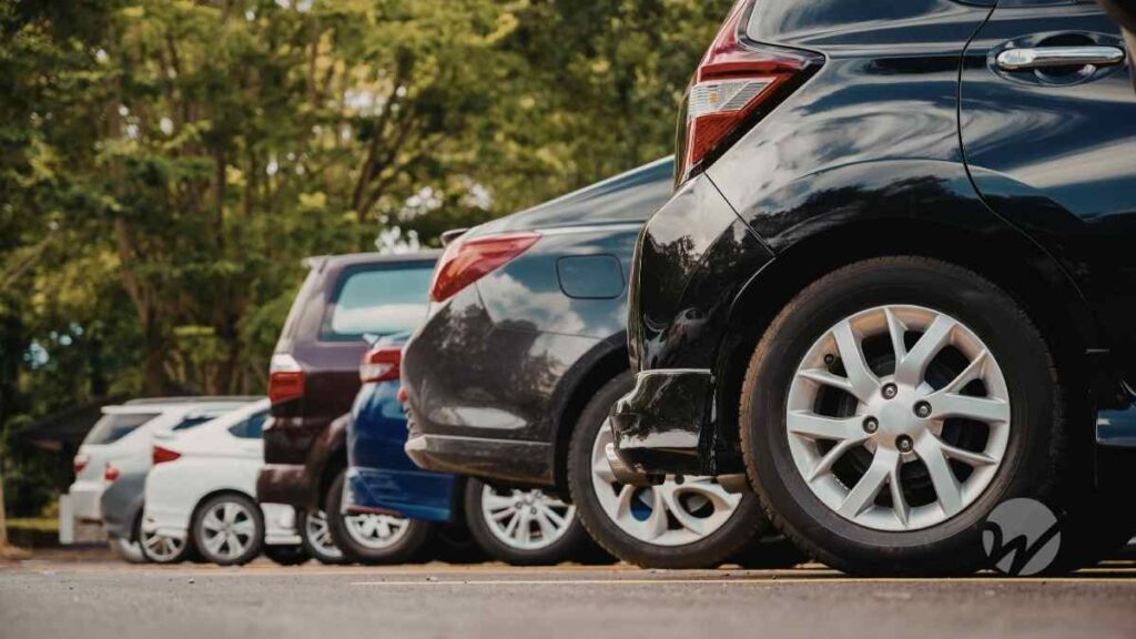 row of cars in parking lot