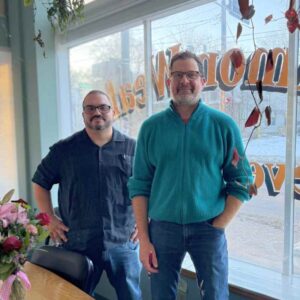 Photo of Dr. Justice Castañeda, Stefan Davidson inside the Common Wealth Development office