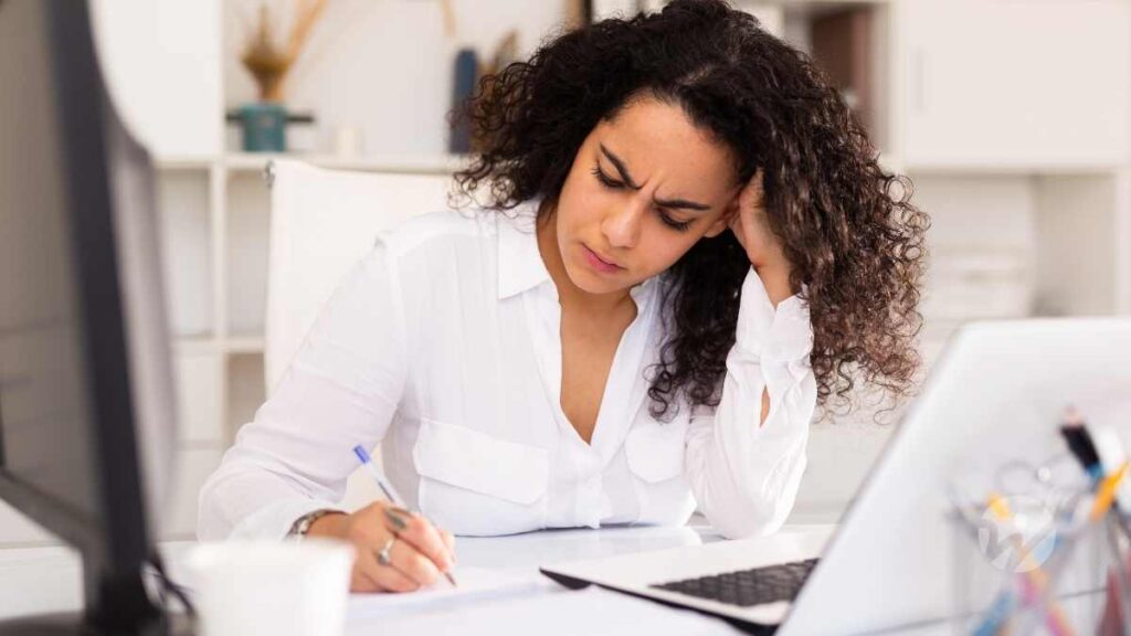 Frustrated woman at computer