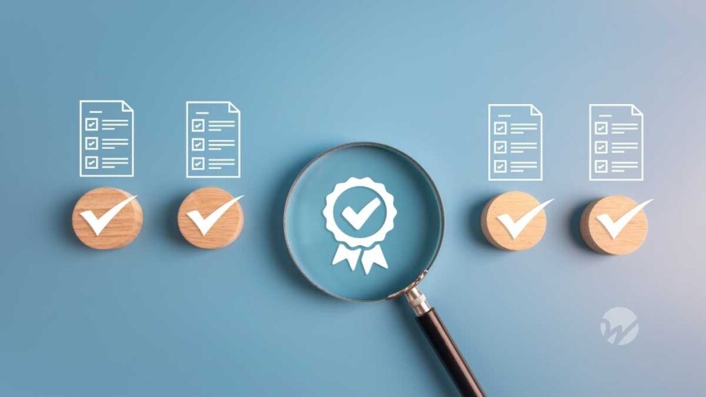 Magnifying glass highlighting a certification icon, surrounded by checklist documents and check marks, representing preparation for income tax disclosure requirements ASU 2023-09